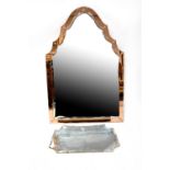 A retro wall mirror with peach glass frame and another smaller shaped example,