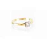 An 18ct gold diamond solitaire ring, square cut diamond set in white gold square mount, size P,