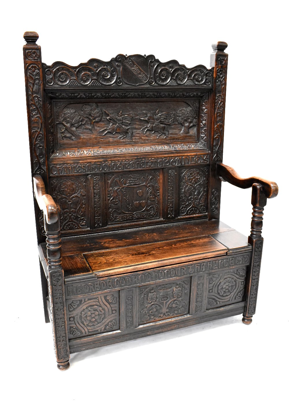 An antique and later carved box seat settle,