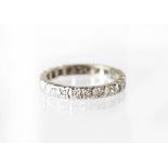 An 18ct white gold ring set with twenty-two illusion-set diamonds, size P/Q.