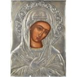 An antique Russian painted icon depicting the portrait of The Virgin Mary on wood panel protected