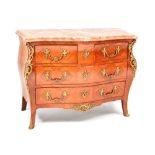 A French-style reproduction bombe commode of two short over two long drawers,