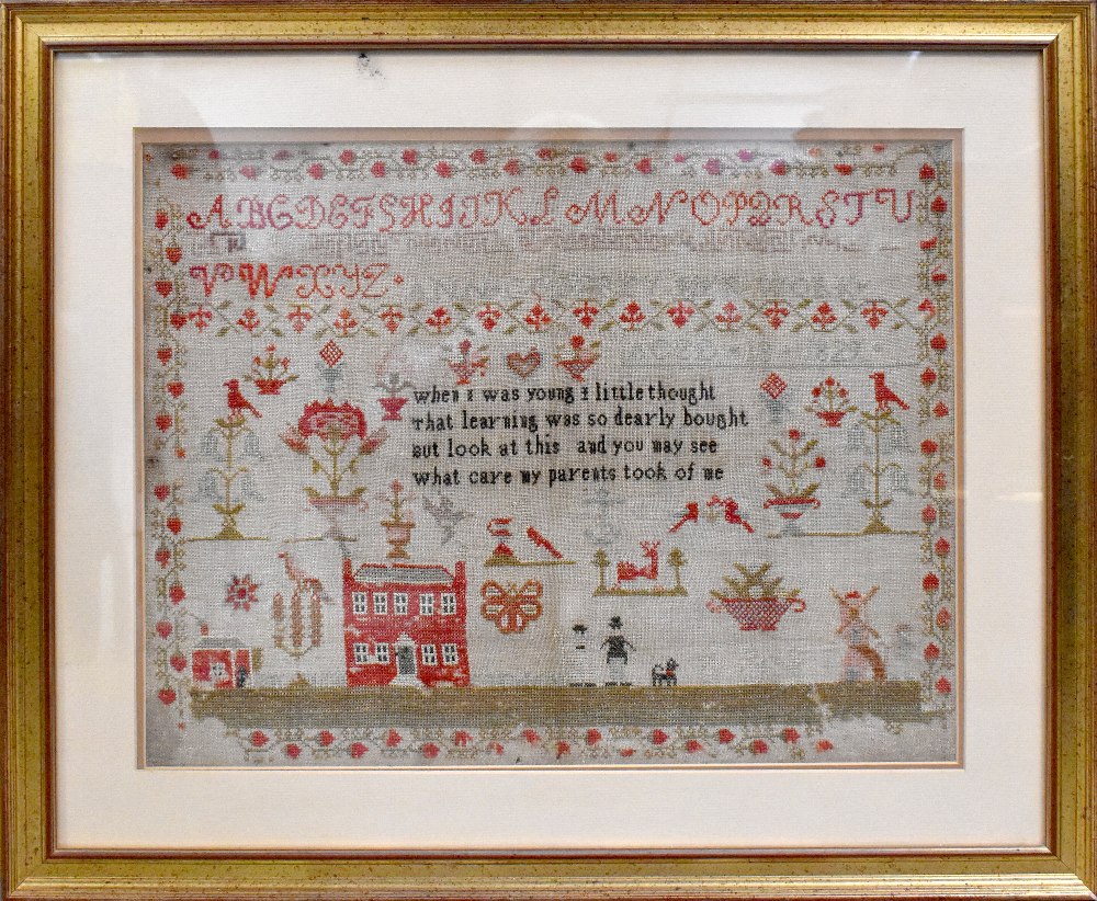 A 19th century sampler by Ann Godfrey aged thirteen, dated 1829, 43 x 54cm, framed and glazed.