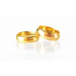 Two 22ct gold wedding band rings, sizes J and N, combined approx 14.5g (2).