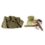 A green Army overcoat bearing label 'Flights Ltd' dated 20th August 1943,