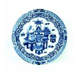 A Chinese blue and white plate depicting vase and writing equipment to centre, diameter 26m (af).