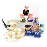 A mixed lot of ceramics to include a set of five Wade NatWest pigs,