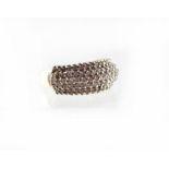 A 9ct gold ring set with five rows of diamonds in claw settings, stamped '375', approx 6g.