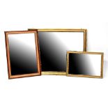 A large contemporary rectangular bevel-edged gilded wall mirror, 89 x 110cm,
