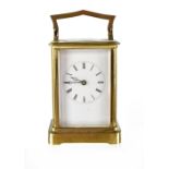 An early 20th century brass-cased carriage clock, the dial set with Roman numerals, height 12cm.