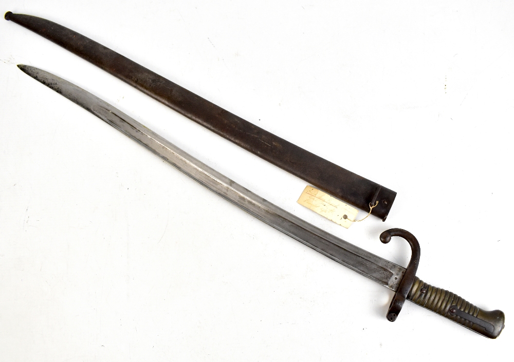 A 19th century French chassepot bayonet with ribbed brass grip and scabbard, length of blade 57cm,