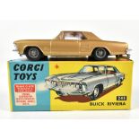 CORGI; a boxed 245 Buick Riviera in gold.Additional InformationLightly play worn, some small