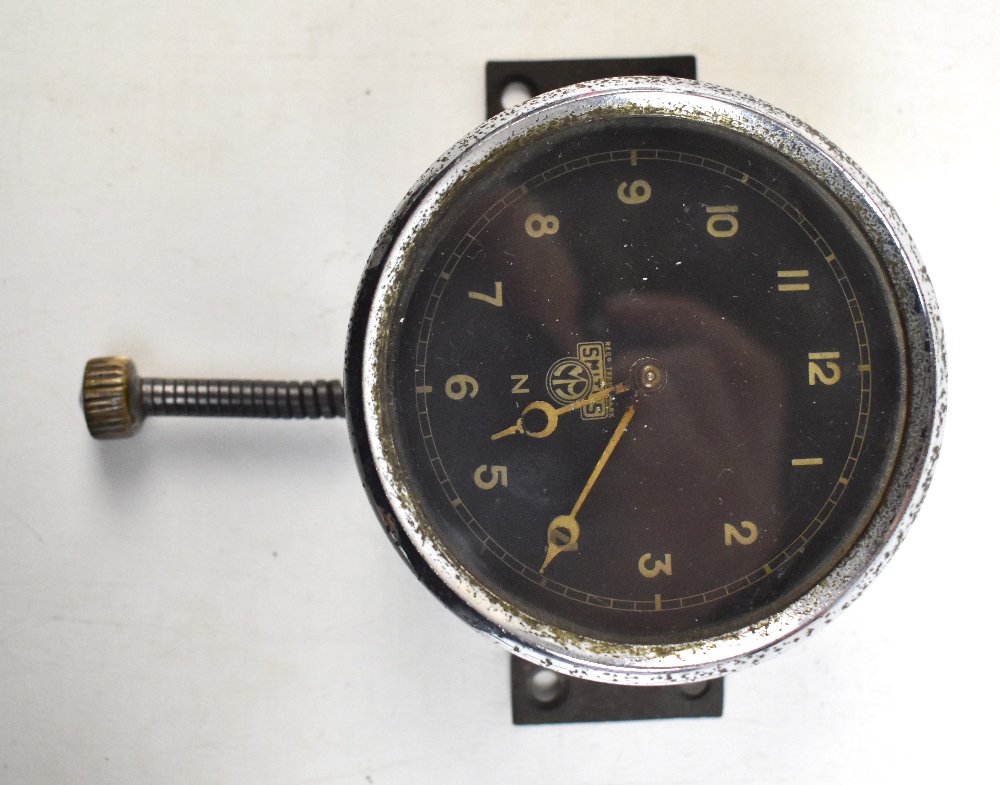 SMITHS; an early to mid-20th century cockpit clock, the black military dial set with Arabic numerals