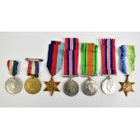 Two WWII medal groups with trio comprising War Medal, 1939-1945 and Atlantic Stars, in box of