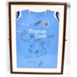 MANCHESTER CITY; a Reebok home shirt signed by the 2011-12 title winning squad, including Sergio '