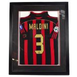 PAOLO MALDINI; a match-worn AC Milan home shirt, set in contemporary frame, 90 x 73.5cm.Additional