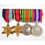 A WWII medal group of four comprising War and Defence Medals, 1939-1945 and Burma Stars awarded to a