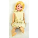 WELSCH & CO; an early 20th century Max Oscar Arnold bisque head doll with blond wig, open/closed