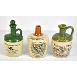 WHISKY INTEREST; three advertising whisky jugs comprising two Tullamore Dew bottles, one lacking