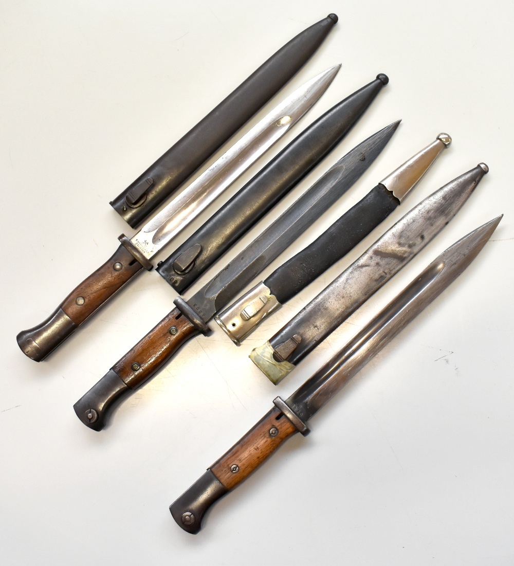 F. HERDER; a WWI period Walter & Co bayonet and scabbard, length 40.5cm, two further bayonets and