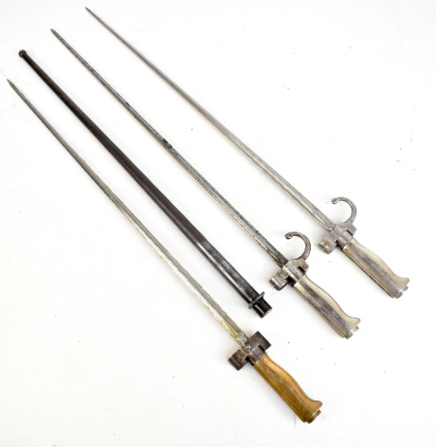 Three early 20th century bayonets comprising a French Model 1886 Lable example with brass handle and