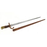 A late 19th century French bayonet, the blade back signed and dated 1879, length of blade 52cm, with