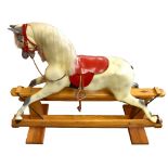 HADDON ROCKERS; a modern painted rocking horse, raised on pine plinth base, with original 'Haddon