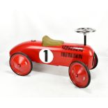 VILAC; a child's sit-on model race car in red livery with ‘1’ decals, length approx 70cm.