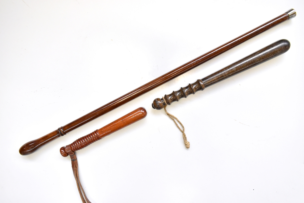 A mid-20th century Police Inspector's dress stick, length 82cm, and two truncheons (3).Additional