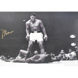 MUHAMMAD ALI; a signed Photofile photograph depicting Ali standing over Sonny Liston after a knock