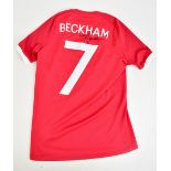DAVID BECKHAM; an England Umbro away shirt signed to reverse with 'Beckham 7' printing, stated