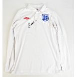 DAVID BECKHAM; a signed England Umbro home shirt, stated size 36 (signed whilst training with