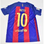 LIONEL MESSI; an FC Barcelona Nike home shirt, signed to reverse with 'Messi 10 Unicef' printing,