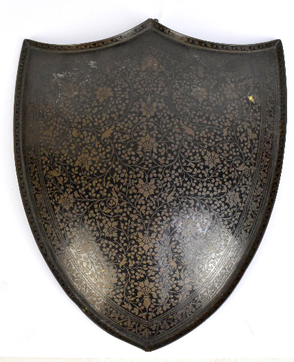 An early 20th century Indian lacquered copper miniature shield profusely decorated with foliate