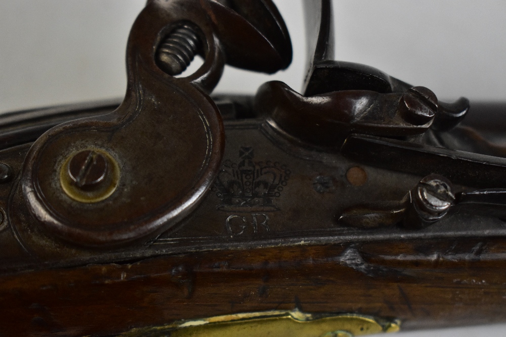 An early 19th century walnut stocked flintlock pistol, the lock plate stamped 'Tower, GR' beneath - Image 2 of 5