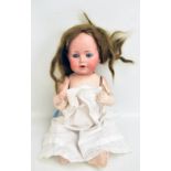 JOHANN DANIEL KESTNER JUNIOR; an early 20th century German bisque headed doll with brown wig (