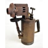 A copper bodied boiler maker's blow lamp, stamped 'Diamantin G. Barthel', with manometer dial,