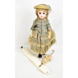 JUMEAU; a late 19th century French walking doll, the bisque head with blonde wig, open brown glass