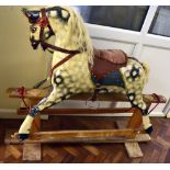 COLLINSON OF LIVERPOOL; an early 20th century rocking horse in dapple grey with white mane,