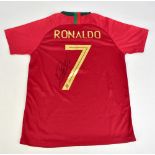 CRISTIANO RONALDO; a Portugal Nike home shirt, signed to the reverse with 'Ronaldo 7' printing, size