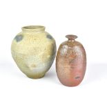 CLAYTON AMEMIYA; a wood fired stoneware jar with incised pattern to shoulder and an oval bottle,