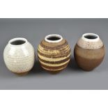 ANNETTE WELCH; a group of three small stoneware jars, impressed AW marks, tallest 11cm (3). (D)