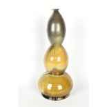 JEFF BROWN: a wood fired stoneware stacked bottle covered in streaky glaze, height 46cm. Brown is