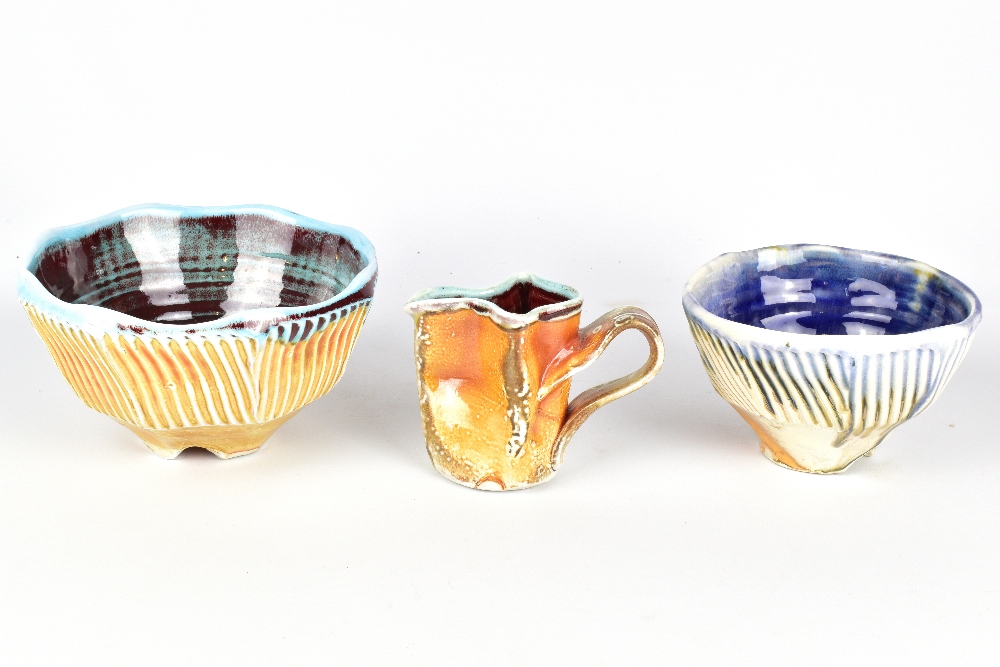 CHRIS BASKIN; two cut sided fluted soda fired porcelain bowls and a small jug, impressed CB marks,