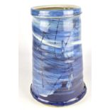 STEVEN GLASS; a tapered stoneware vase with incised decoration on blue and white ground, painted