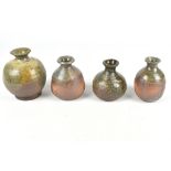 CLAYTON AMEMIYA; a group of four small wood fired stoneware bottles, incised CA marks, tallest