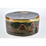 JOHN GLICK (1938-2017); an oval stoneware box and cover with wavy rim and painterly decoration,