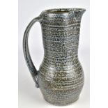 ANNE METTE HJORTSHOJ (born 1973); a salt glazed jug with iron and cobalt slip and incised