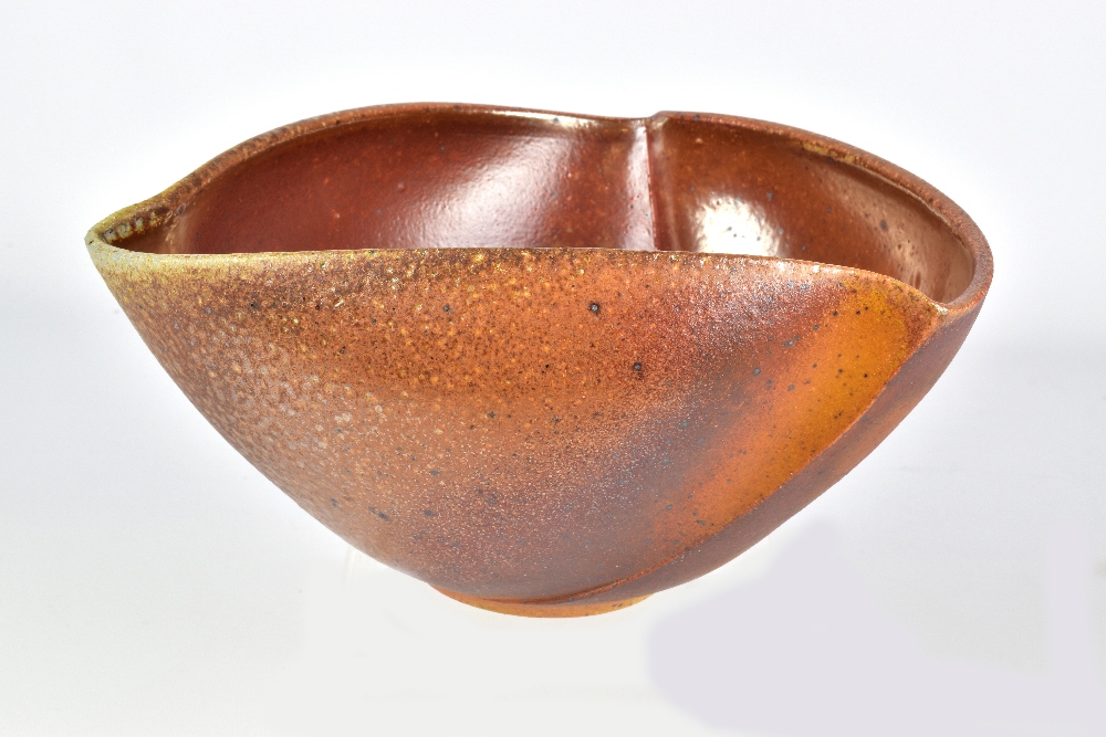 GERALD BEN; a triangular wood fired stoneware bowl, incised signature, diameter 20cm. Provenance: