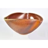 GERALD BEN; a triangular wood fired stoneware bowl, incised signature, diameter 20cm. Provenance: